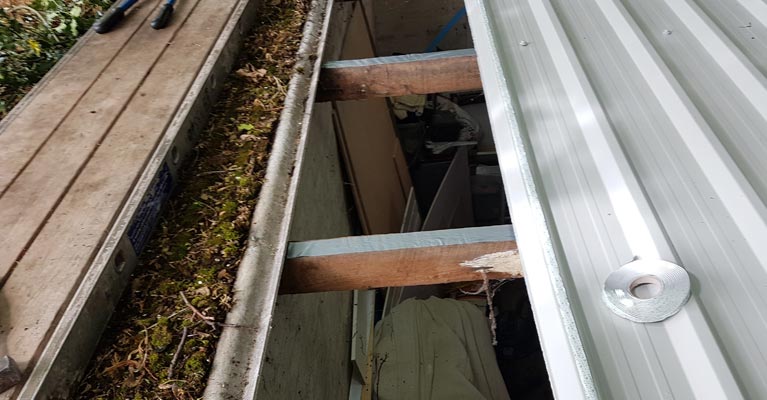 New plastisol coated steel profiled sheeting replacing low risk asbestos cement panels.