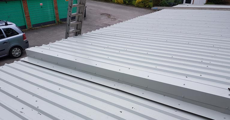 Step-up flashing joint installed to join two roof levels.