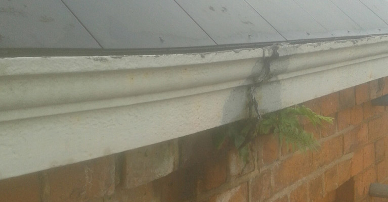 The church roof gutter joint was leaking causing moss to grow