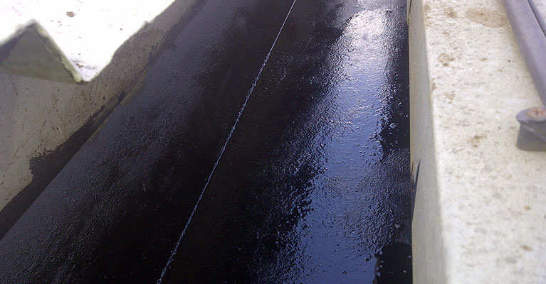 Bitumen applied to gutter
