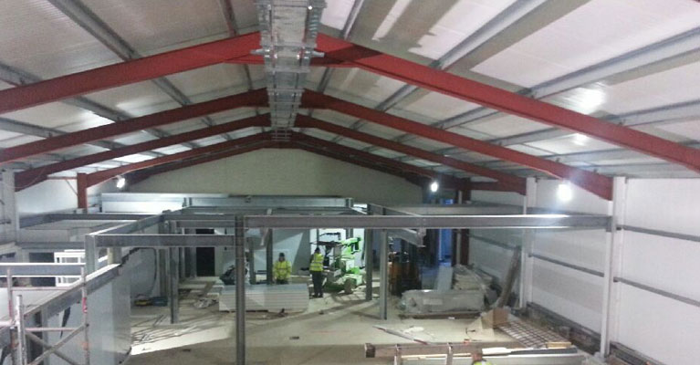 Inside view towards the end of the industrial roofing in Cirencester
