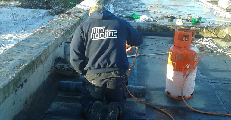 Our felt roofing experts in Burntwood applying the Torch On felt