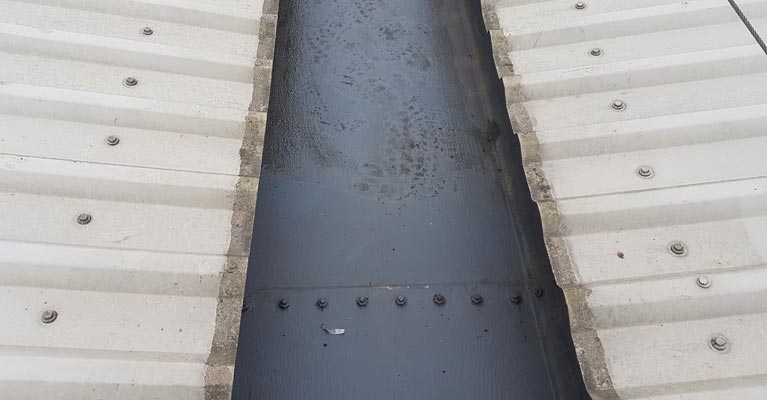 View of one of the gutters after being cleaned out.