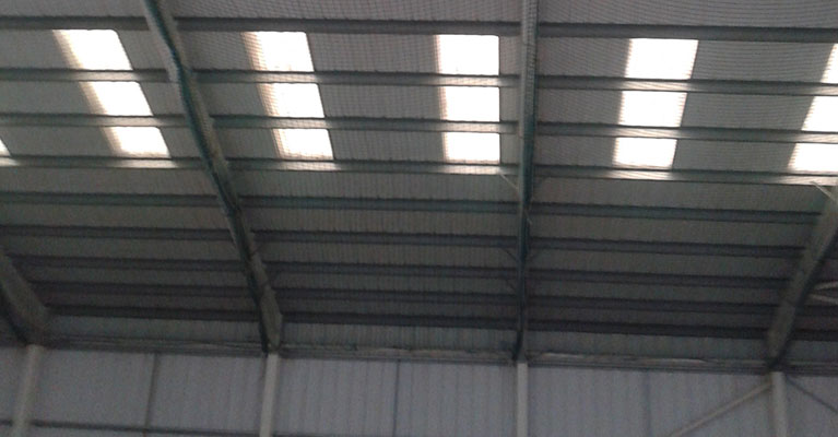 Safety netting installed inside using cherry pickers.