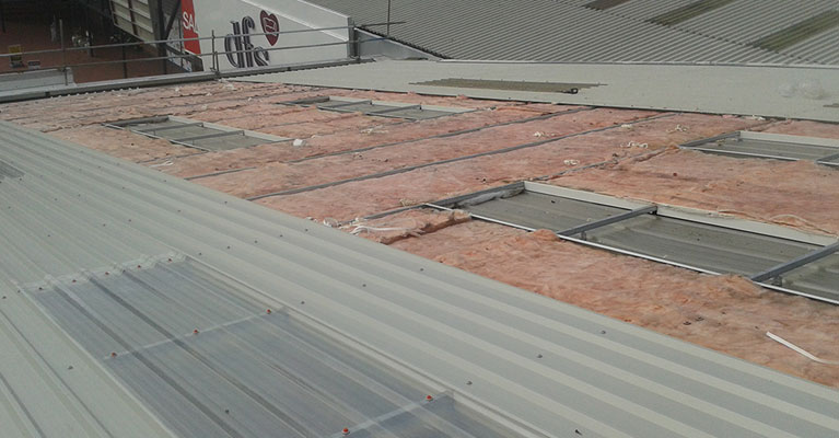 Exposed existing fibre glass insulation.