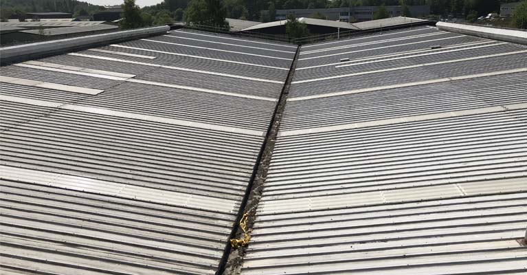 View across two roof slopes with newly installed GRP roof lights.
