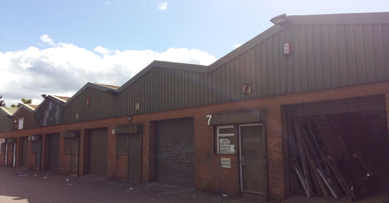 Existing metal wall cladding in Walsall before work commenced.
