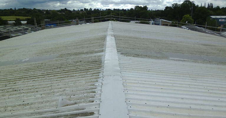 Roof part cleaned using a high pressure washer